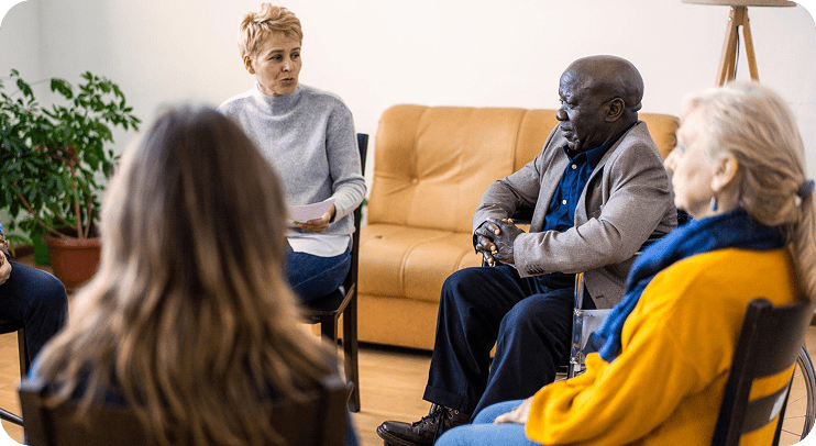 People sitting in a group discussion circle.