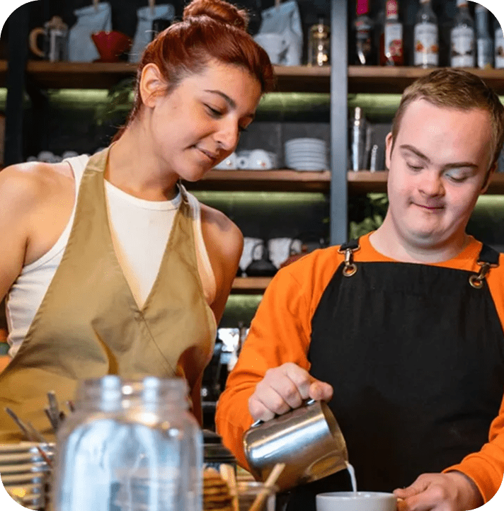Barista duo preparing coffee at café.