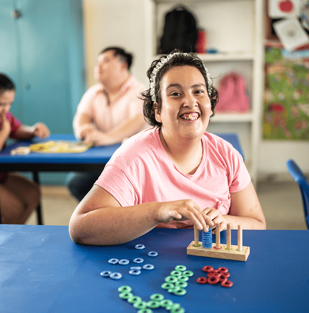 Person playing with colorful educational toy.